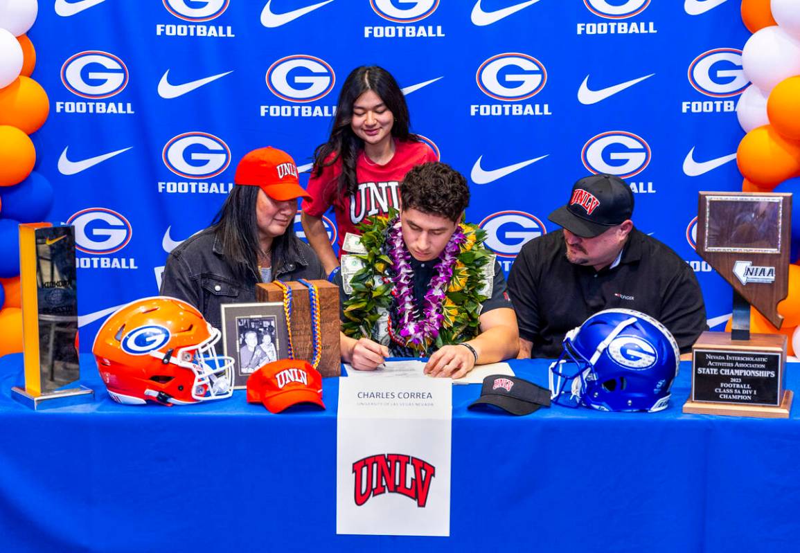 Bishop Gorman player Charles Correa and family with a commitment letter to UNLV during a Nation ...