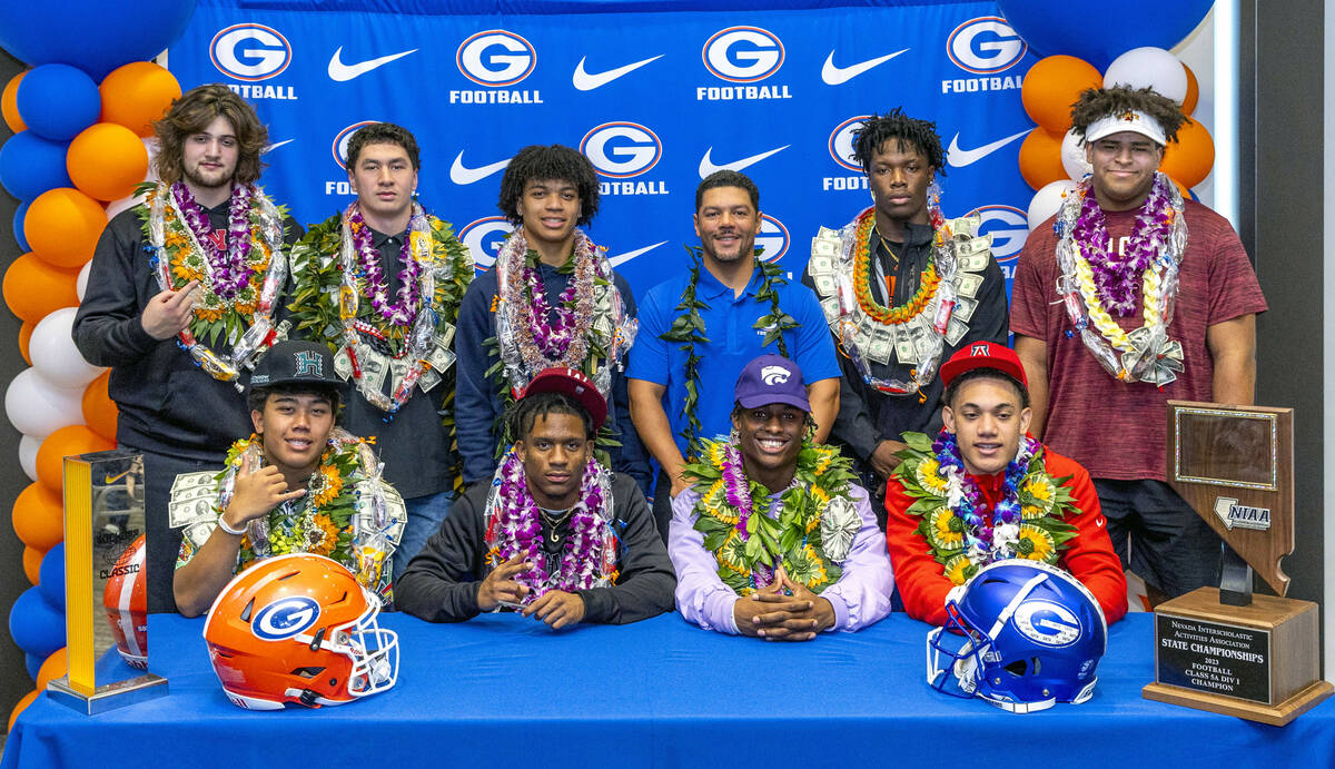 Bishop Gorman football players with head coach Brent Browner after signing their commitment let ...