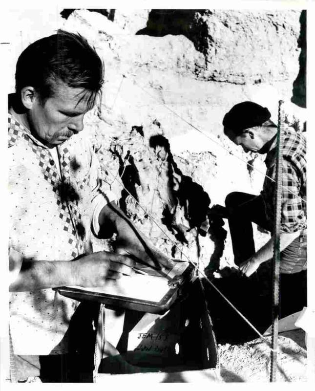 Dick Brooks, left, charts the progress in removing the bones of a prehistoric bison, a relative ...