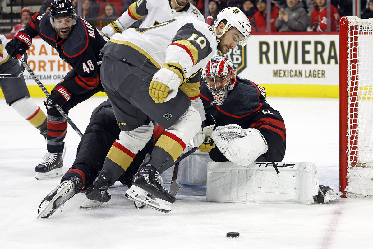 Vegas Golden Knights' Nicolas Roy (10) watches as the puck bounces off Carolina Hurricanes goal ...