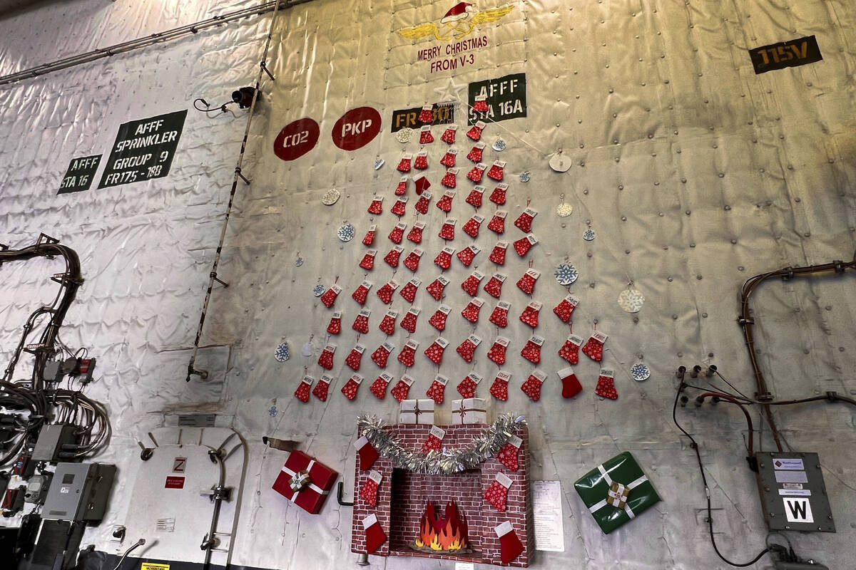 The crew of the USS Gerald R. Ford has put up decorations throughout the ship, including this h ...