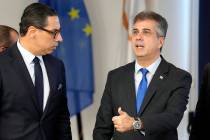 Israeli Foreign Minister Eli Cohen, right, gestures after a meeting with his Cypriot counterpar ...