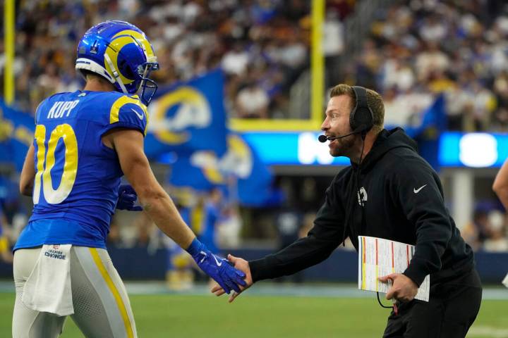 Los Angeles Rams wide receiver Cooper Kupp (10) celebrates a touchdown with head coach Sean McV ...