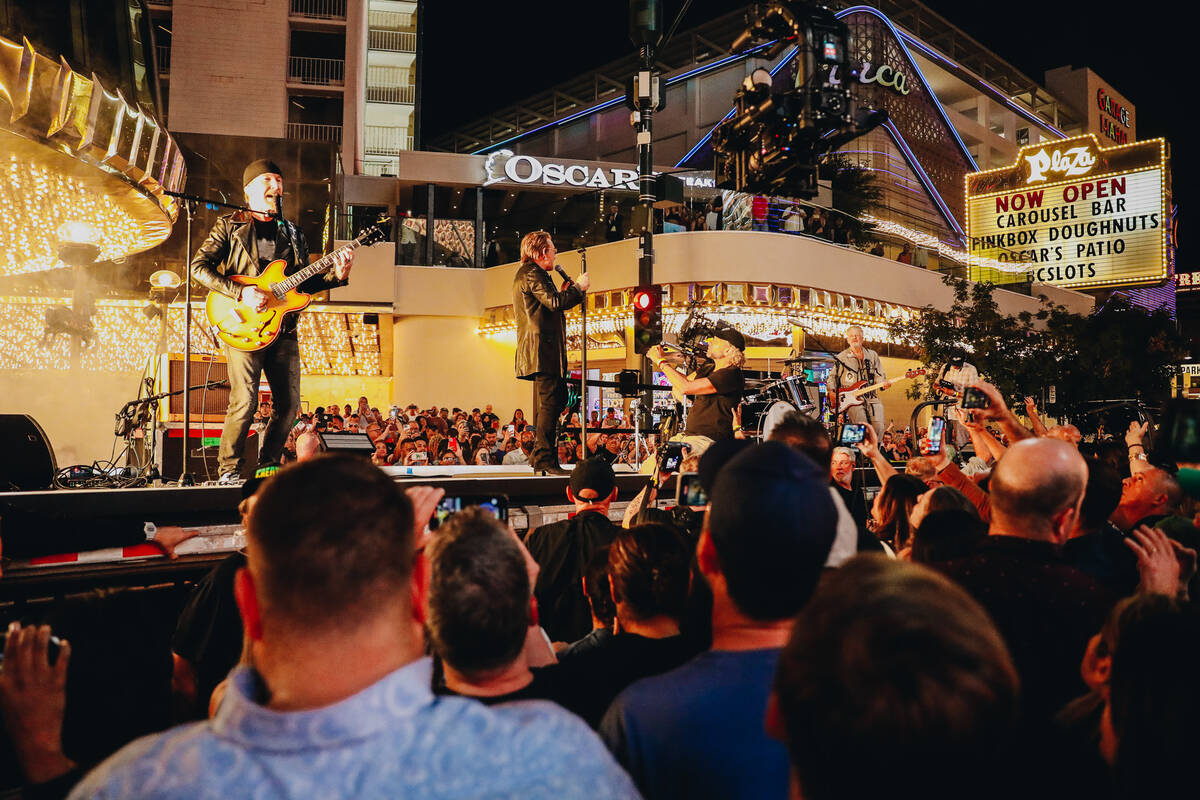 U2 performs a surprise concert while filming the video for "Atomic City" in front of the Plaza ...