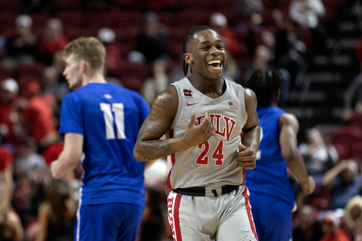 UNLV Rebels guard Jackie Johnson III (24) celebrates after scoring during the second half of an ...