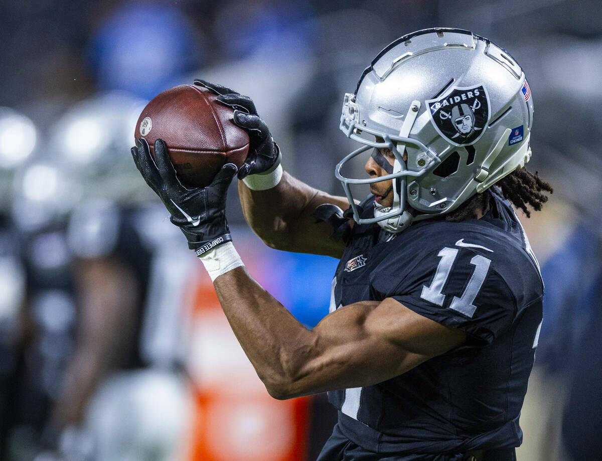 Raiders wide receiver Tre Tucker (11) catches a pass during warmups before the first half of th ...