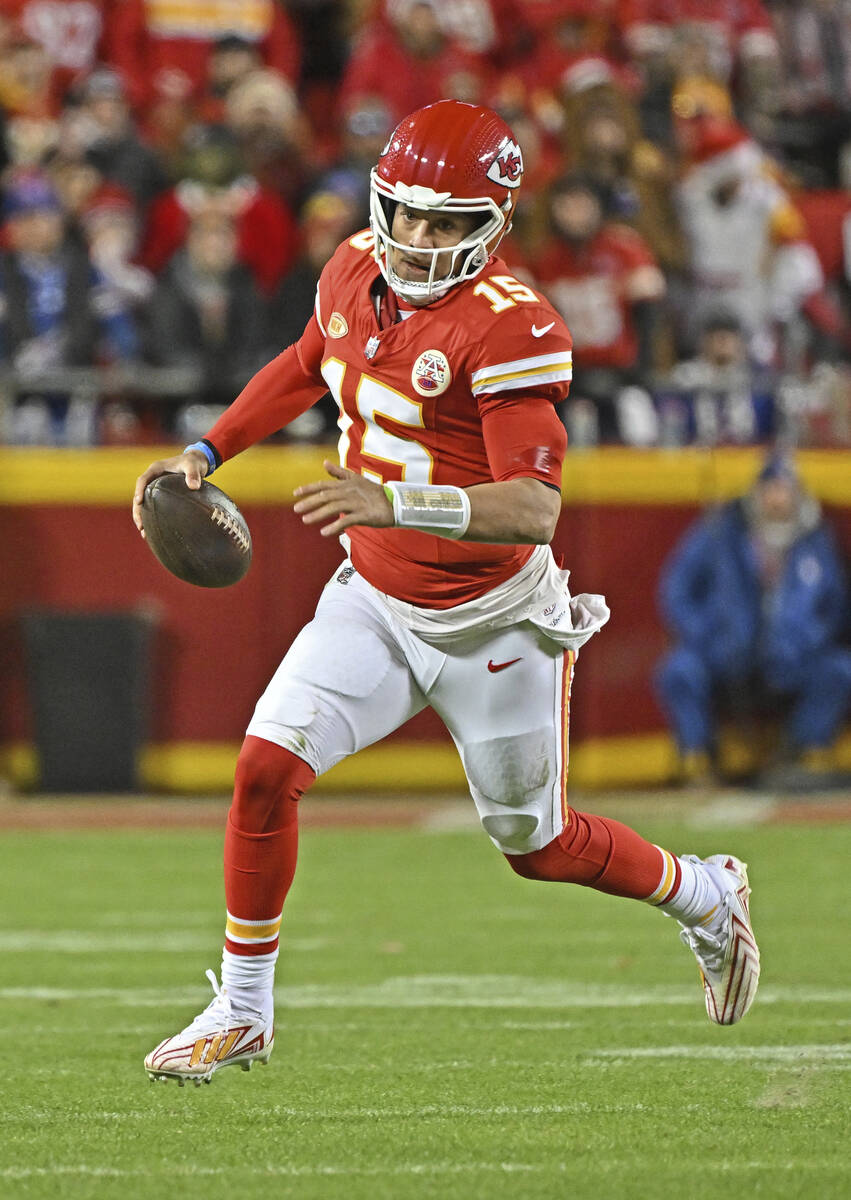 Kansas City Chiefs quarterback Patrick Mahomes (15) runs down field with the ball during an NFL ...