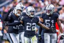 Vegas Raiders running back Ameer Abdullah (22) and teammates celebrate a big tackle on a punt d ...
