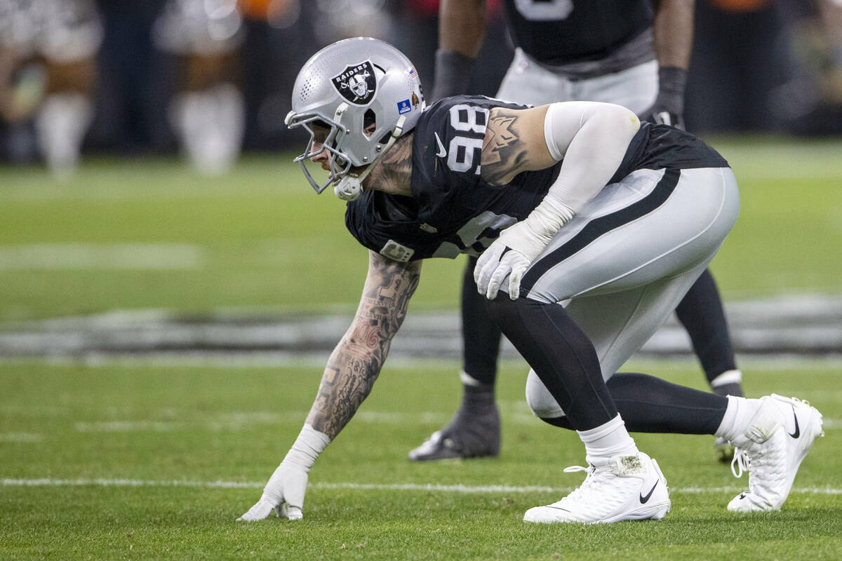 Raiders defensive end Maxx Crosby (98) is set on the line of scrimmage during the first half of ...