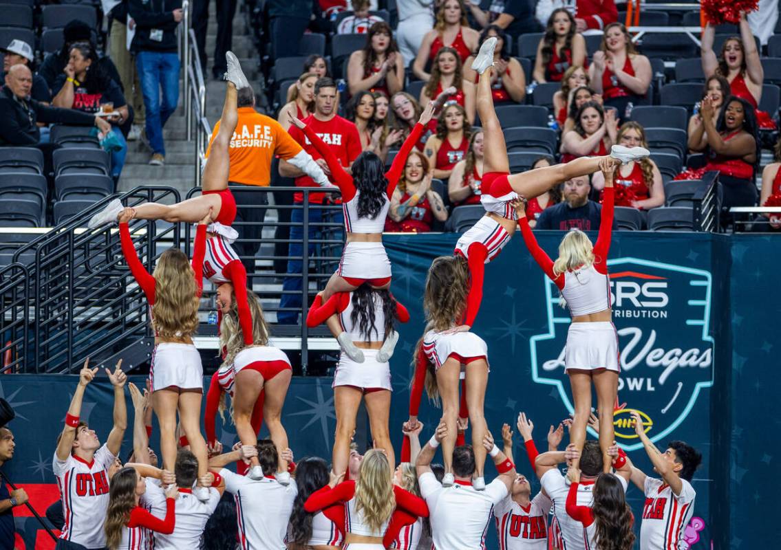 Utah cheerleaders warm up for the crowd as they ready to face Northwestern before the first hal ...