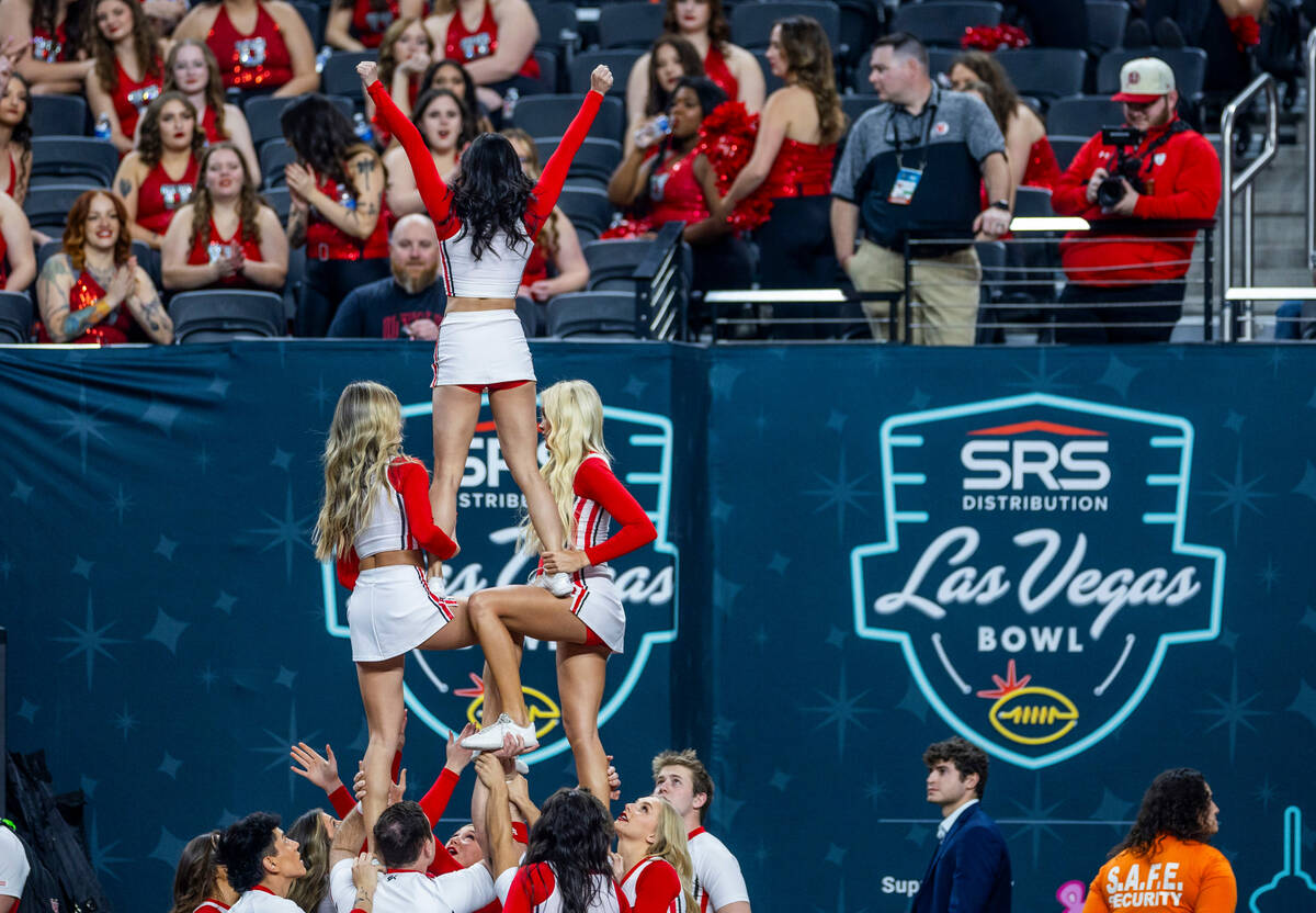 Utah cheerleaders warm up for the crowd as they ready to face Northwestern before the first hal ...
