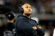 Raiders head coach Antonio Pierce looks to the replay monitor during the first half of an NFL g ...