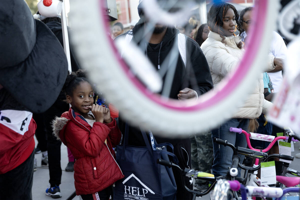 A young attendee of a Christmas block party, organized by Take Back the Block and Metropolitan ...
