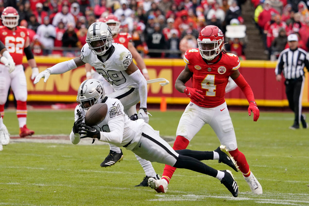 Las Vegas Raiders cornerback Amik Robertson (21) is unable to intercept a pass during the first ...