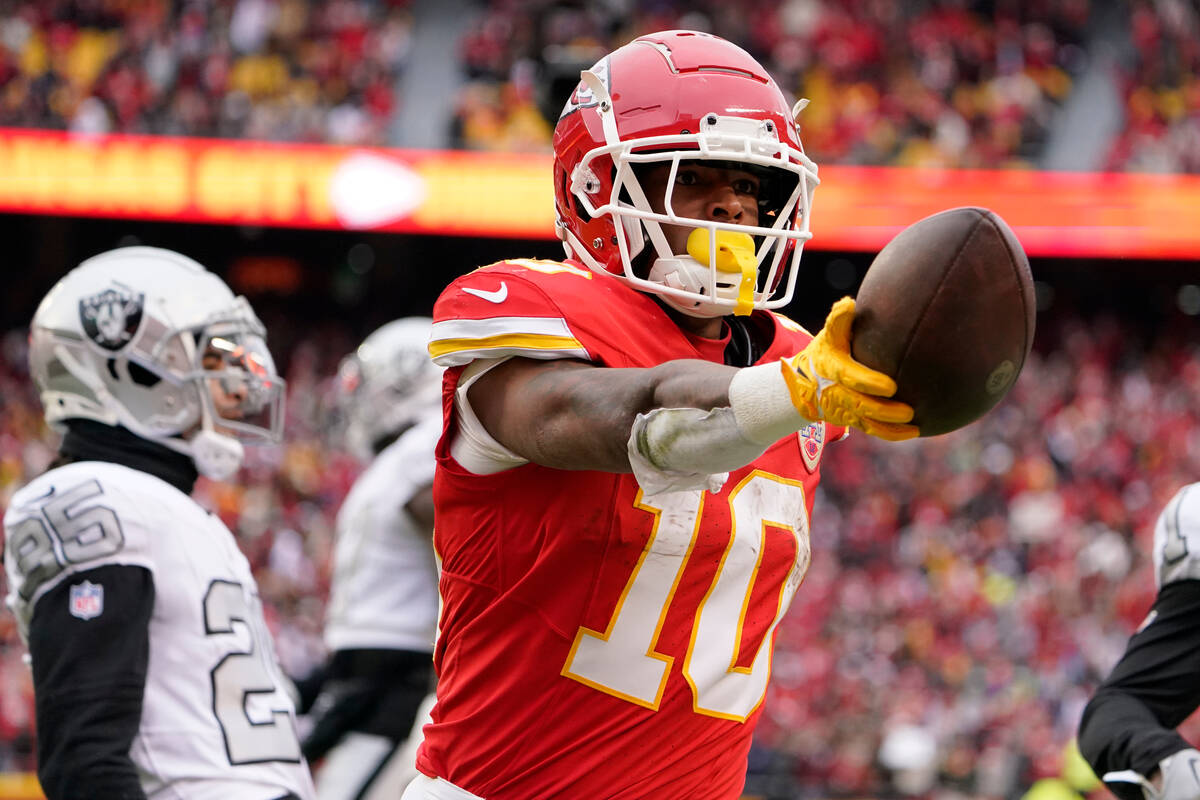 Kansas City Chiefs running back Isiah Pacheco (10) celebrates after scoring during the first ha ...