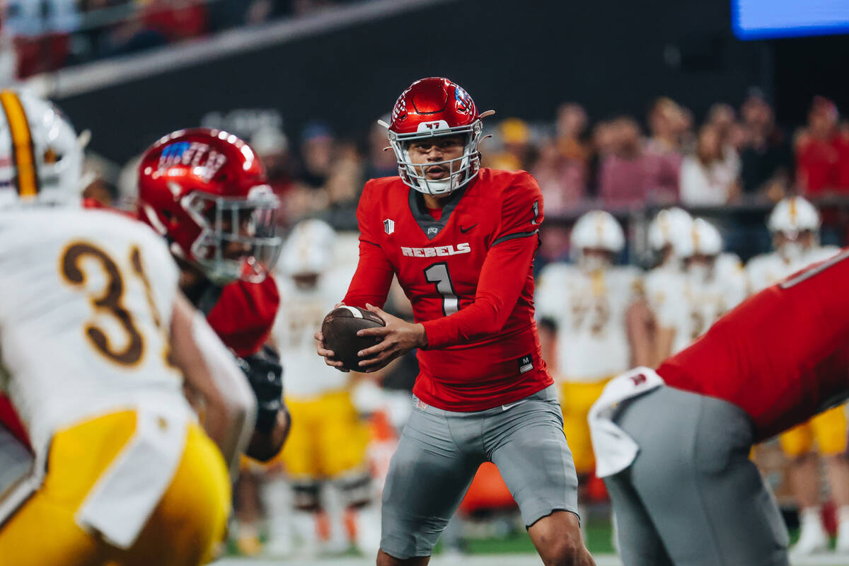 UNLV quarterback Jayden Maiava (1) passes the ball on to a teammate during a game against Wyomi ...