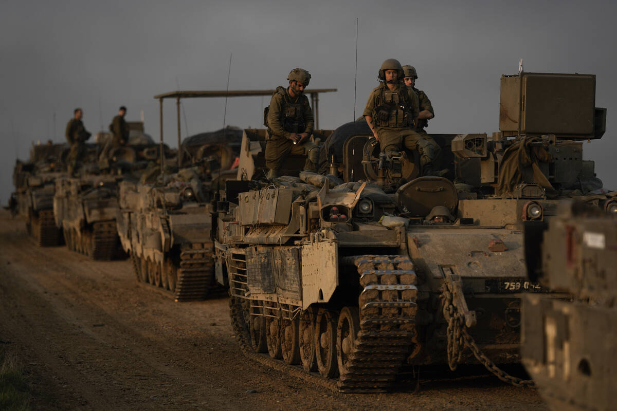 A convoy of Israeli army armoured personnel carriers (APC) is seen near the Israeli-Gaza border ...