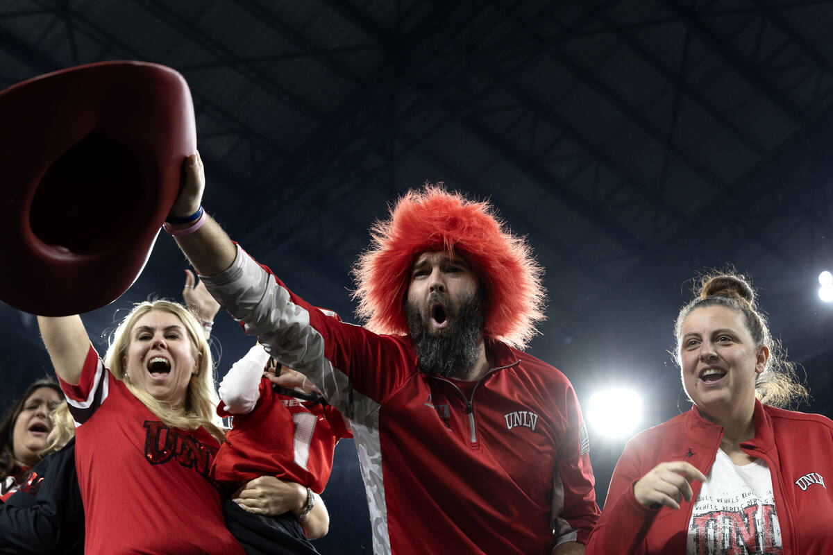 UNLV Rebels fans cheer for their team before the Guaranteed Rate Bowl NCAA college football gam ...