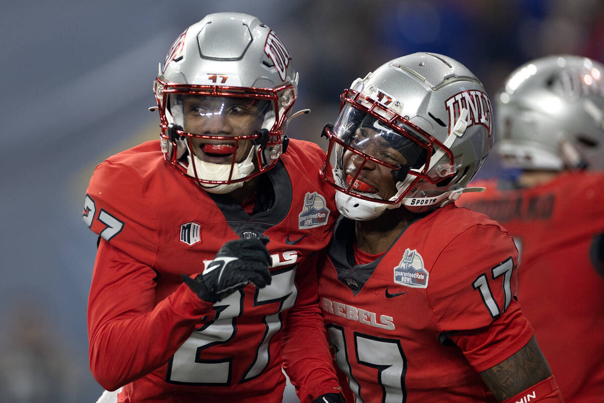 UNLV Rebels defensive back BJ Harris (27) and defensive back Kris Williams (17) celebrate after ...