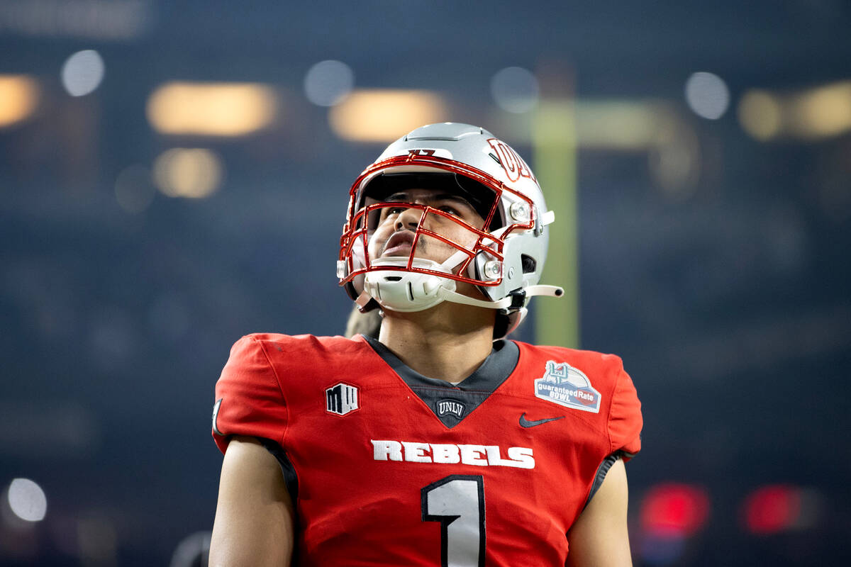 UNLV Rebels quarterback Jayden Maiava (1) watches the replay on screen while the Kansas Jayhawk ...