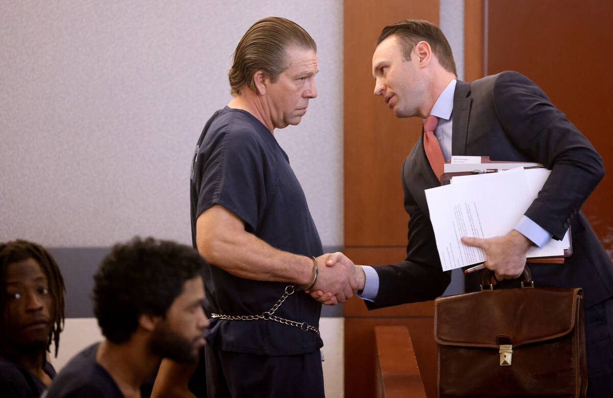 Christopher Hall, who is accused in a fatal shooting involving a stolen car, talks to his attor ...