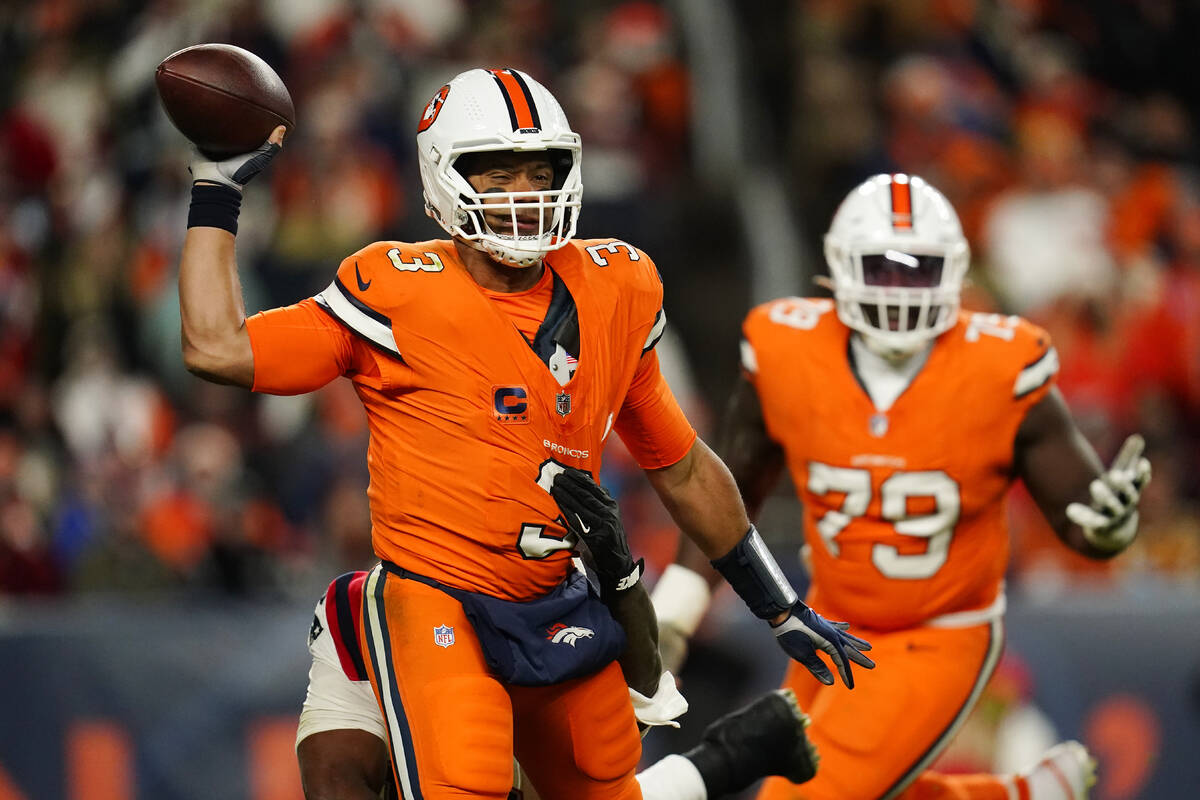 Denver Broncos quarterback Russell Wilson (3) throws during the second half of an NFL football ...