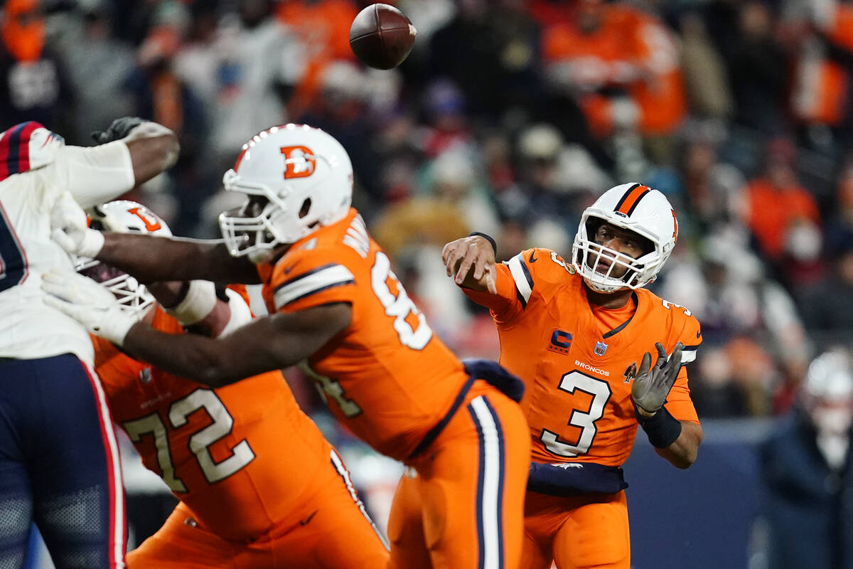 Denver Broncos quarterback Russell Wilson (3) throws during the second half of an NFL football ...