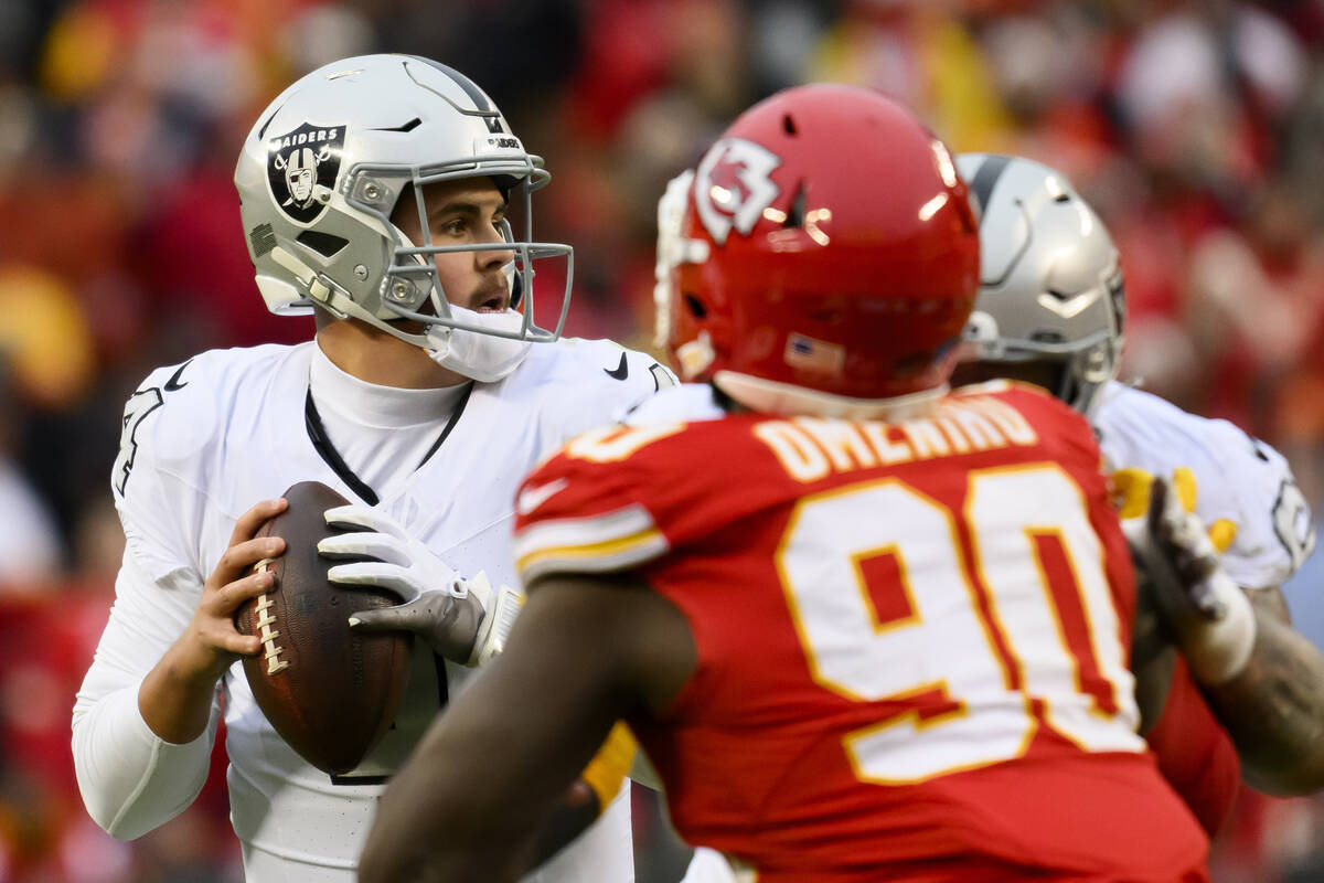 Las Vegas Raiders quarterback Aidan O'Connell looks to pass during the second half of an NFL fo ...