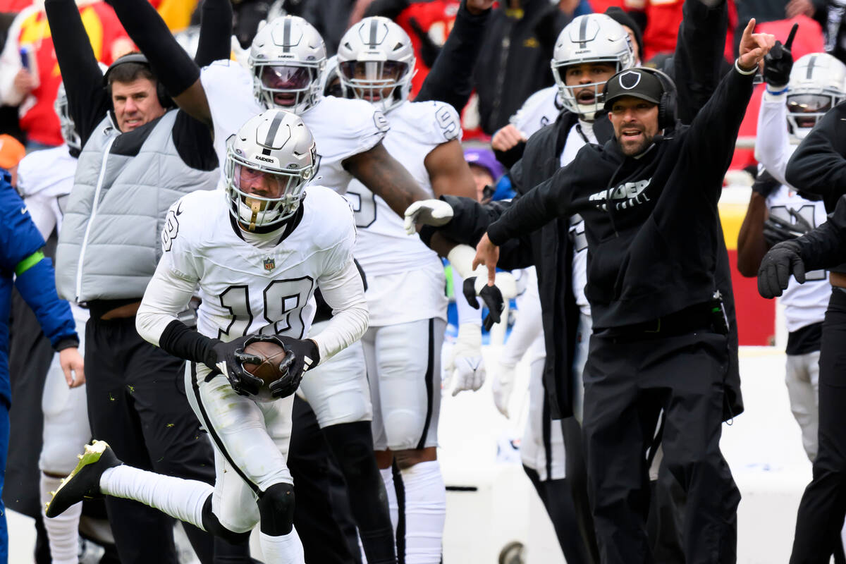 The Las Vegas Raiders sideline celebrates as Raiders cornerback Jack Jones (18) takes an interc ...