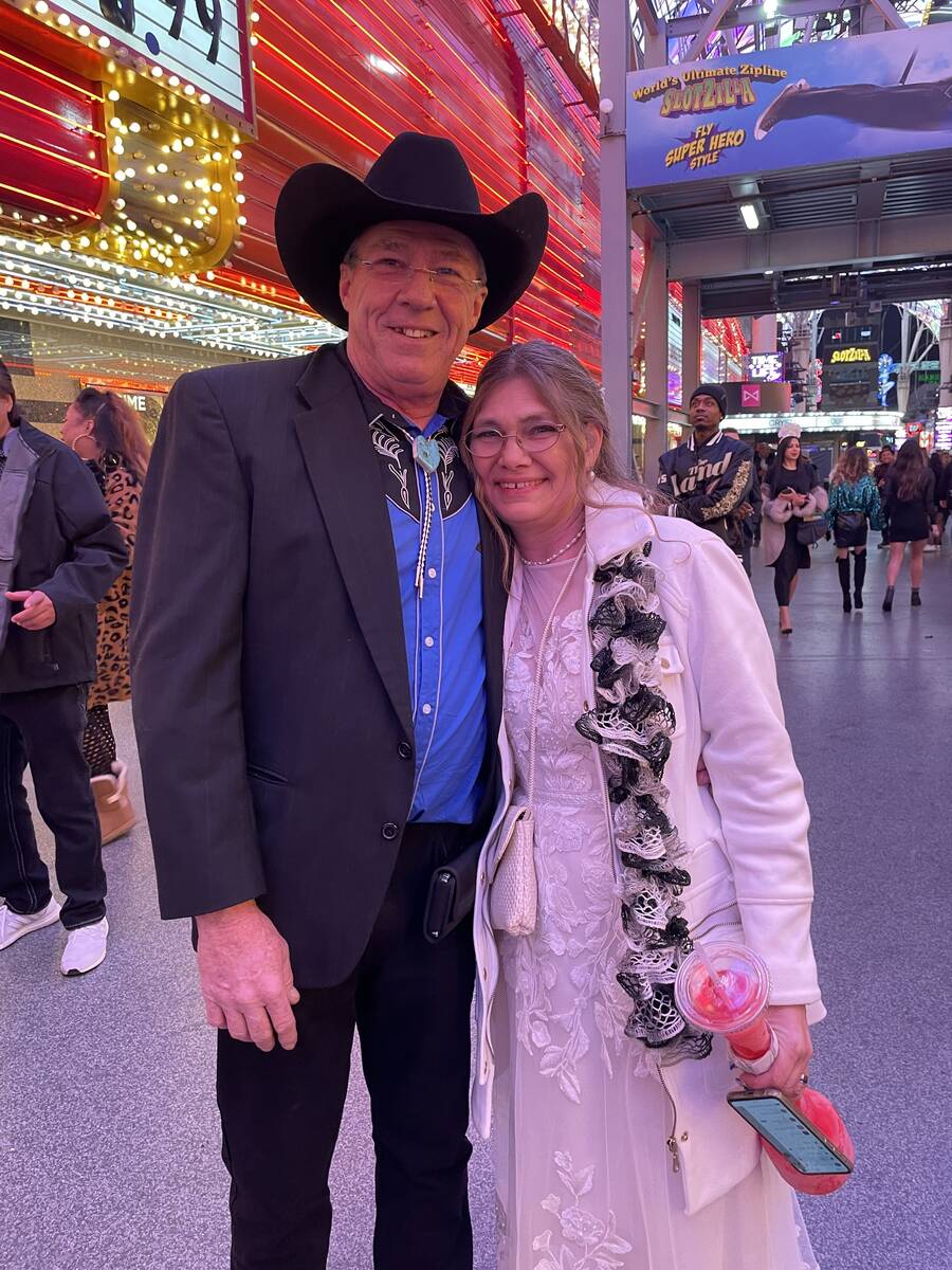 Newlyweds Carrie and Mike Servis from Michigan arrived at the Fremont Street Experience in thei ...