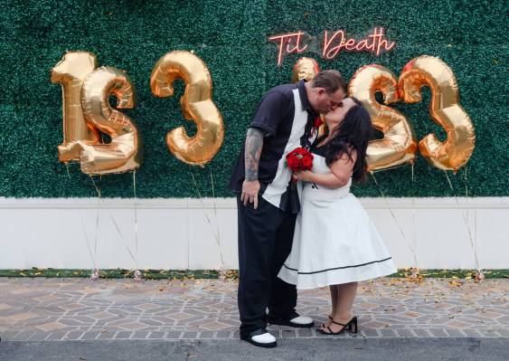 Billy Traughber kisses his new bride Karie Rockwood at the Viva Las Vegas Wedding Chapel in Las ...