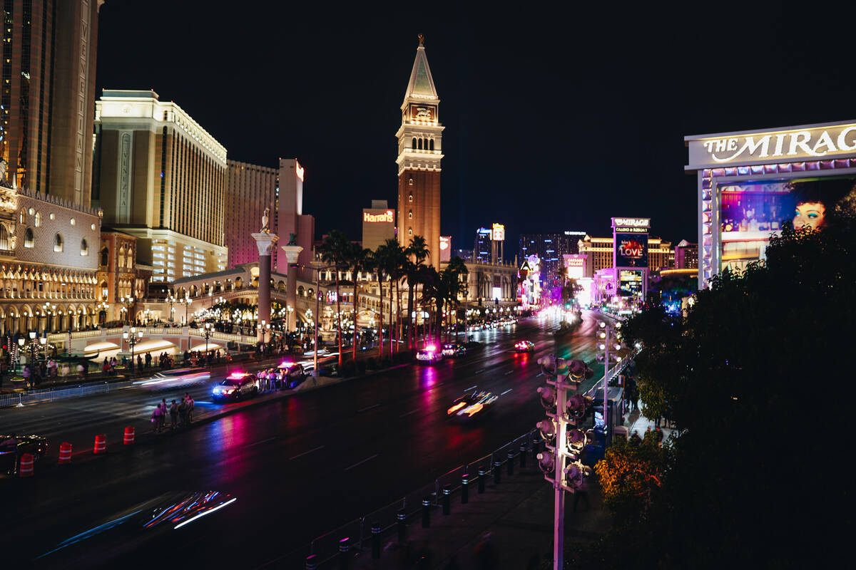 Cars drive through the Strip before it closes for New Year’s Eve on Sunday, Dec. 31, 202 ...