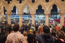 Sightseers at The Venetian stop for a look at the Formula One Las Vegas Grand Prix. (Patrick B ...