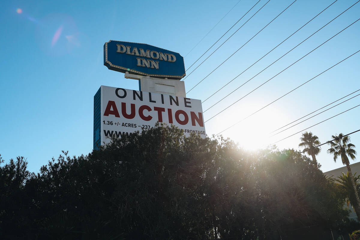 The sign for the Diamond Inn Motel is seen with an auction sign beneath it at the Diamond Inn M ...