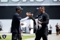 Raiders director of pro personnel Dwayne Joseph, left, talks with interim general manager Champ ...