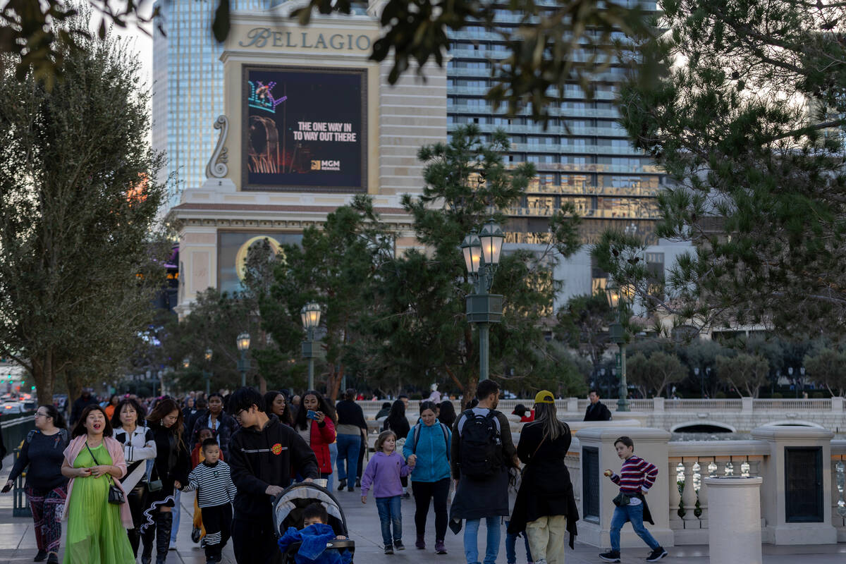 Pedestrians pass the Bellagio Fountains on Friday, Dec. 29, 2023, on the Las Vegas Strip. The i ...