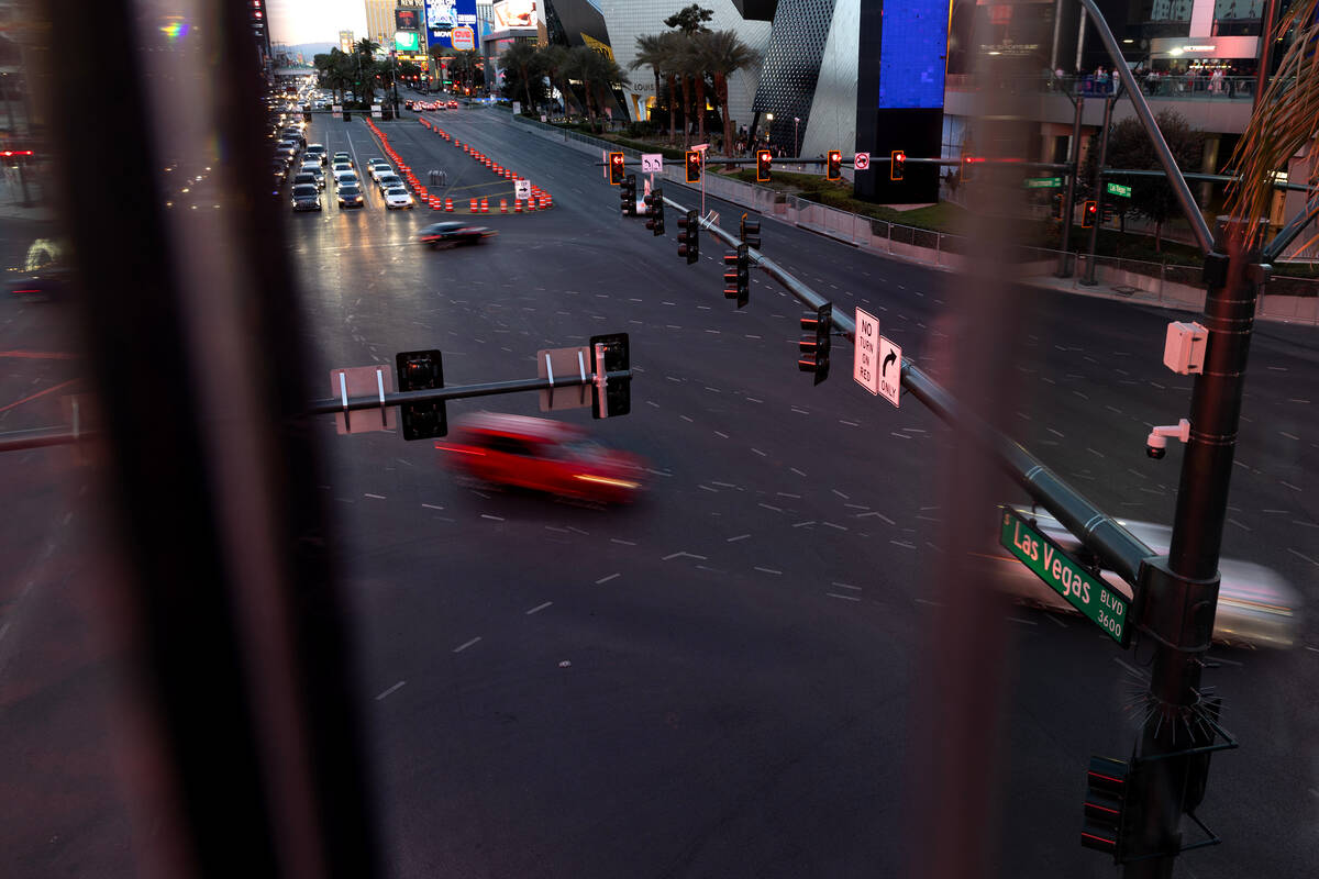 Traffic moves through the intersection of West Harmon Avenue and South Las Vegas Boulevard, whi ...