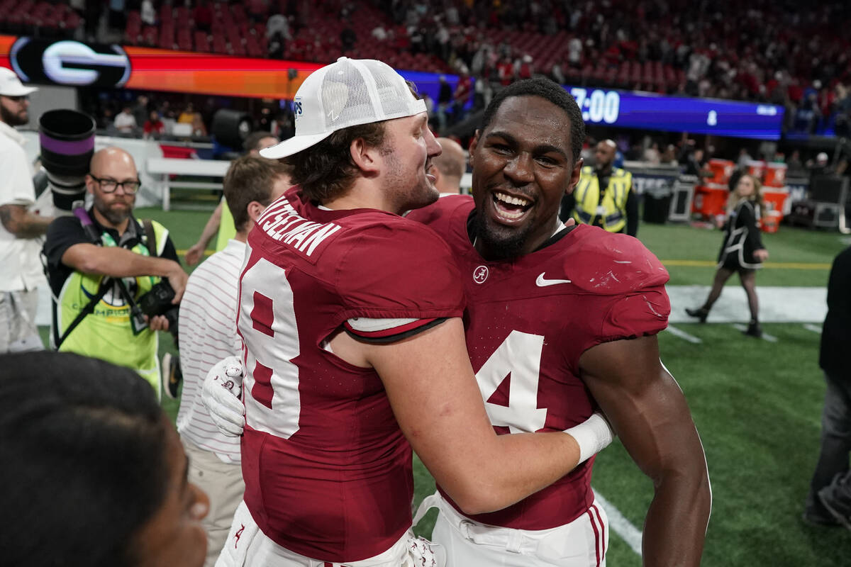 Alabama players celebrate after the Southeastern Conference championship NCAA college football ...
