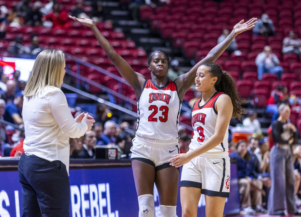UNLV Lady Rebels center Desi-Rae Young (23) wants some love from the crowd as she and guard Kia ...