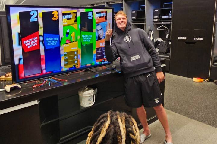 Raiders kicker Daniel Carlson celebrates after winning a game of Super Smash Bros. Ultimate in ...