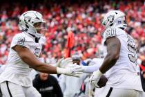 Las Vegas Raiders defensive end Tyree Wilson (9) congratulate Raiders defensive tackle Bilal Ni ...