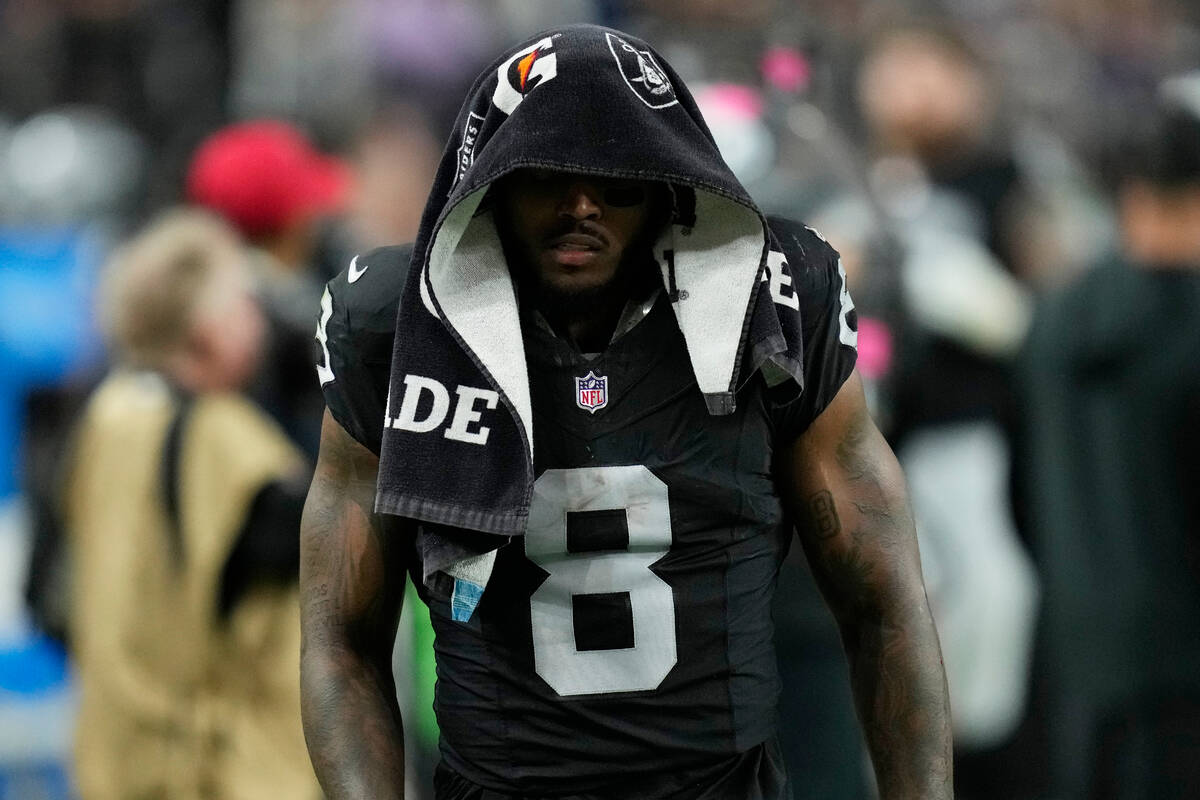 Las Vegas Raiders running back Josh Jacobs (8) walks out of the stadium after getting injured a ...
