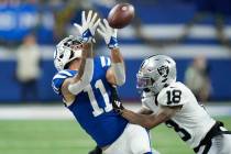 Indianapolis Colts wide receiver Michael Pittman Jr. (11) misses on a catch attempt next to Las ...
