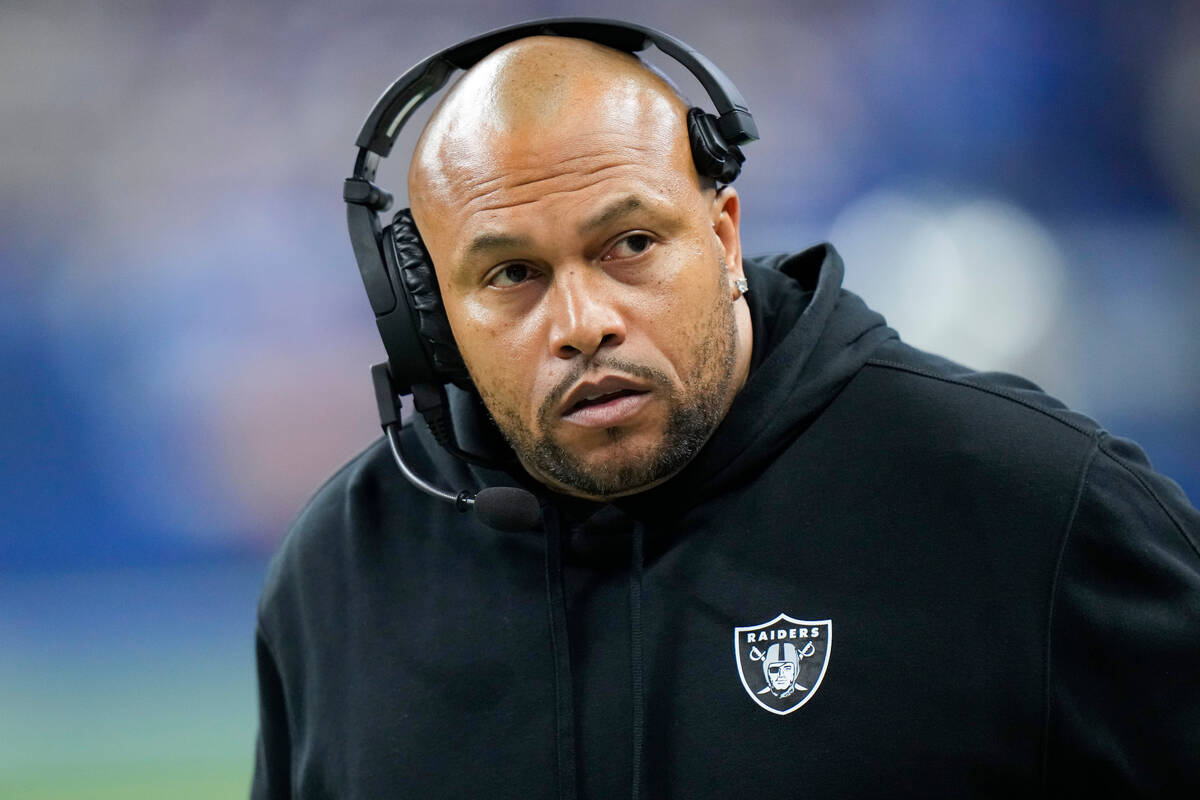 Las Vegas Raiders head coach Antonio Pierce walks along the sideline during the first half of a ...