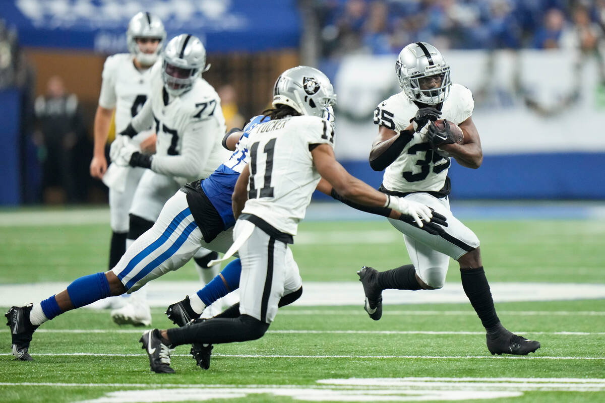 Las Vegas Raiders running back Zamir White (35) carries against the Indianapolis Colts during t ...