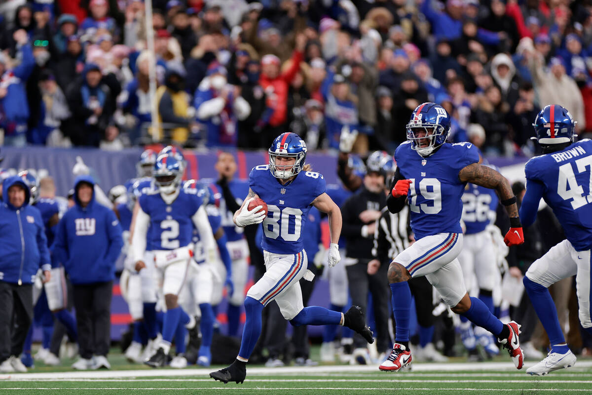 New York Giants wide receiver Gunner Olszewski (80) runs in a touchdown on a punt return during ...