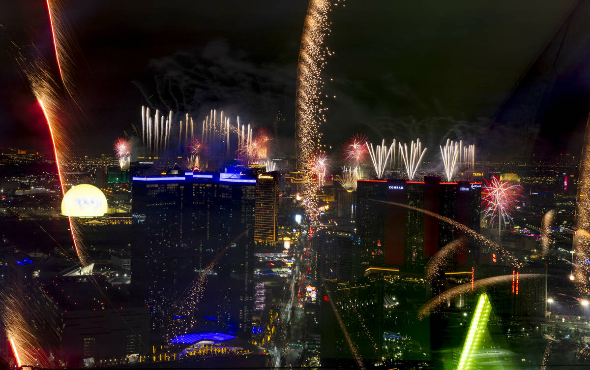 Fireworks erupt over the Las Vegas Strip as part of New Years Eve festivities across the city f ...