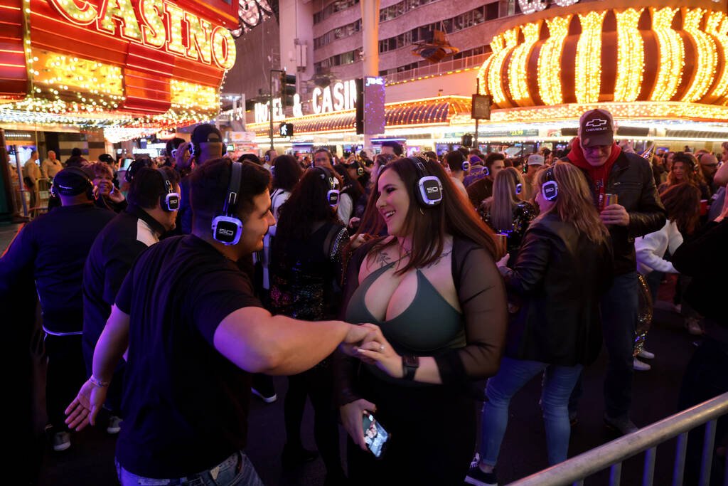 New Year’s Eve revelers dance in the silent disco during the Time of Your Life Festival ...