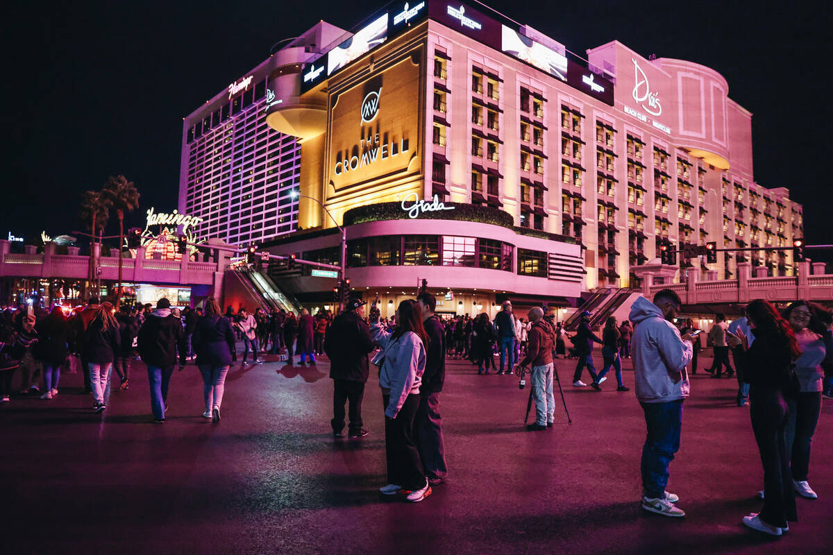 New Year’s Eve revelers take to the roads on the Strip after they were shut down to vehi ...