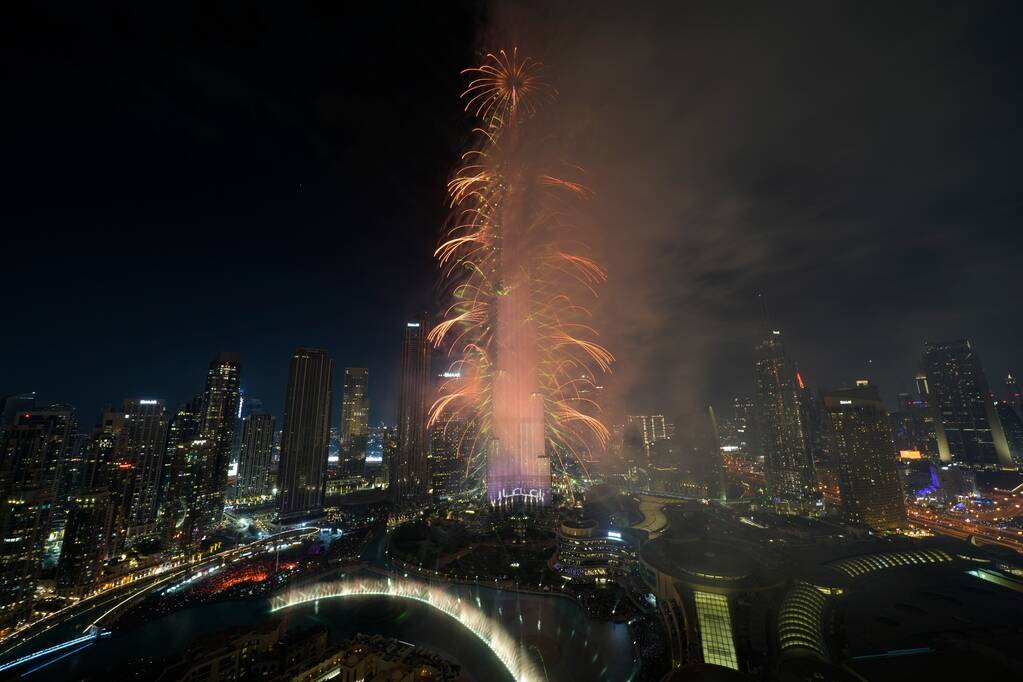 Fireworks explode at the Burj Khalifa, the world's tallest building, during the New Year's Eve ...